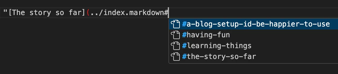 Screenshot of me typing a link in VS Code. I have written index dot markdown, then added a hash, and an autocomplete helper has popped up all the anchor links on that page.
